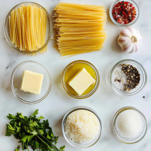 Ingredients for capellini pasta recipe including capellini, garlic, lemon, Parmesan cheese, olive oil, butter, and parsley.