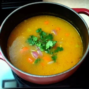 Encebollado broth simmering with fresh tuna, yuca, and Ecuadorian spices.